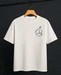 Close-up of Mercedes-Benz graphic design on white oversized t-shirt