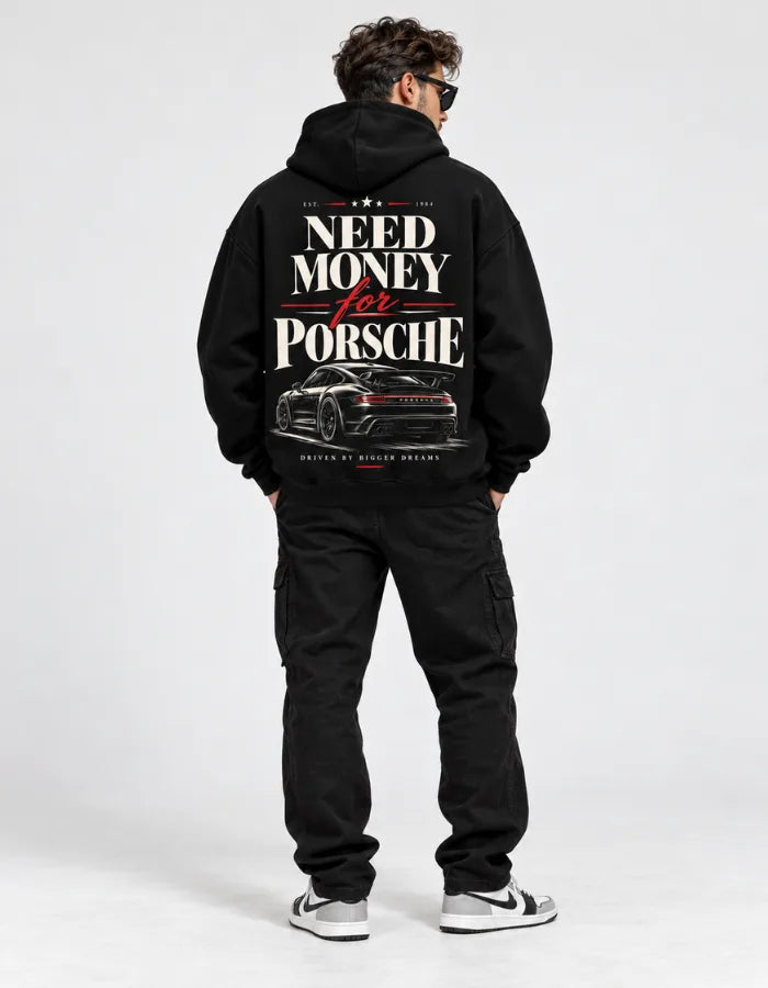 Male model wearing black vintage racing hoodie with Need Money for Porsche back graphic and car illustration
