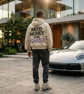 Model wearing a cream Porsche graphic hoodie from behind with dark stencil typography and colorful holographic-style Porsche lettering