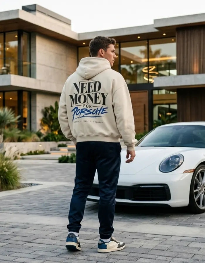 Cream Need Money for Porsche hoodie with charcoal serif lettering, electric-blue Porsche brush script, gold star and Dreams Fuel Progress back print