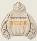 Cream Need Money for Porsche hoodie with a dark-green rectangular text frame and large orange dot-matrix Porsche lettering on the back