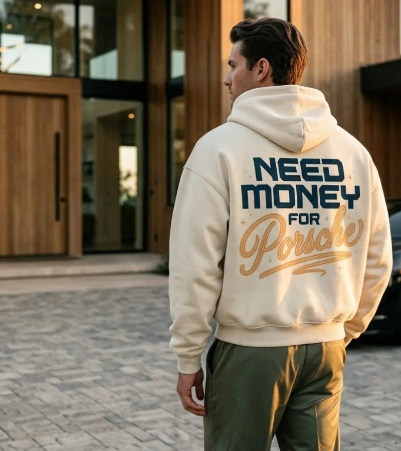 Cream Need Money for Porsche hoodie with arched distressed charcoal lettering, red brush-script Porsche graphic and gold star on the back