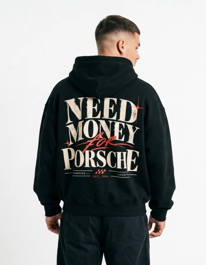 Male model wearing a black Porsche graphic hoodie with distressed cream lettering, red crown and Passion Dreams Lifestyle back print