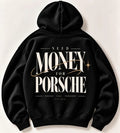 Black Need Money for Porsche hoodie with oversized ivory serif lettering, sweeping gold orbit line and Dreams Fuel Progress back print