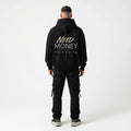 Model wearing black Porsche typography hoodie with cream handwritten lettering, charcoal-grey text and minimalist motivational back design