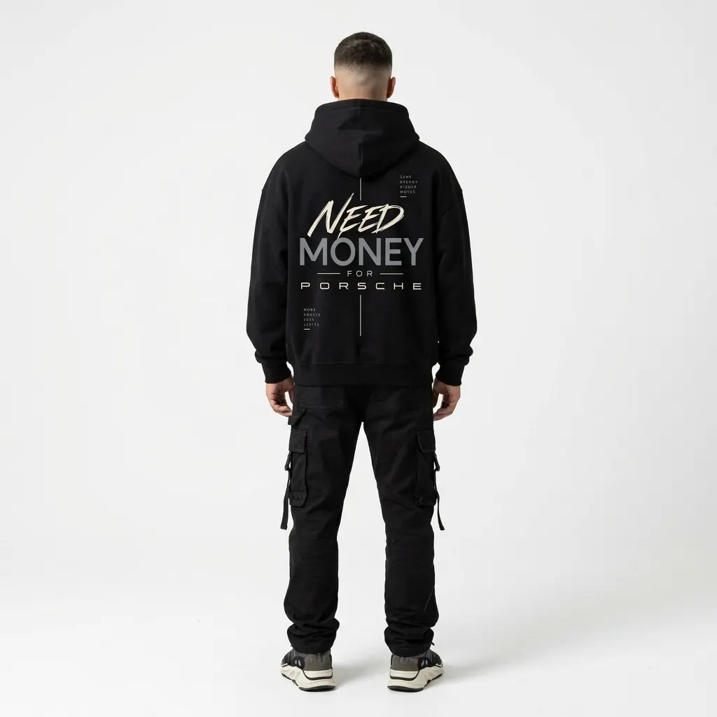 Model wearing black Porsche typography hoodie with cream handwritten lettering, charcoal-grey text and minimalist motivational back design